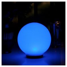 a blue ball sitting on top of a table