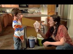 a woman and boy are in the kitchen