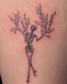 a skeleton with flowers on its back