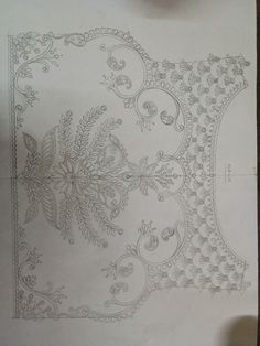 a piece of paper with an intricate design on it's side and the bottom corner