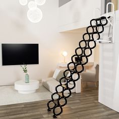 a living room with white furniture and a spiral staircase in the center, leading to a flat screen tv