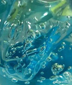 water is being poured into a blue bowl