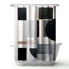 a shower curtain with black, white and grey designs on the outside of each curtain