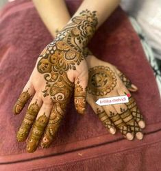 henna tattoo on the hands of a woman