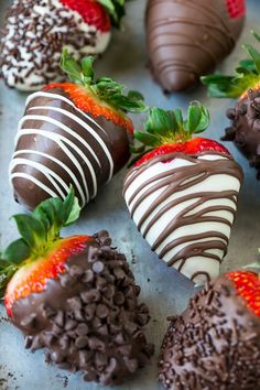 chocolate covered strawberries are arranged on a baking sheet