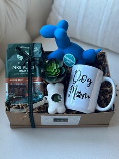 a dog mom gift box with coffee mug, succulents and other items