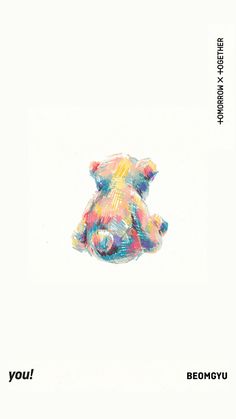 a colorful teddy bear sitting on top of a white surface with the words you above it