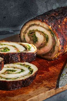 sliced meatloaf on cutting board with knife next to it