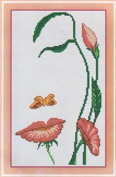 a cross stitch picture with flowers and a lady's face