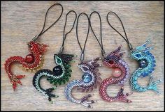 six dragon beaded necklaces on a table