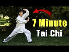 the man is practicing tai chi in front of trees with an arrow pointing at him