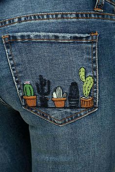 the back pocket of a pair of jeans with cactus and cacti embroidered on it