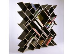 a bookshelf made out of several different types of bookcases and shelves