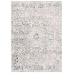 an area rug with faded blue and white colors on it, including a large medallion design