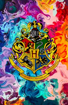 the hogwarts crest is shown on an abstract background with multicolored swirls