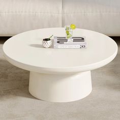 a white coffee table sitting on top of a carpeted floor