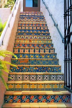 the stairs are decorated with colorful tiles