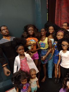 a group of dolls standing next to each other