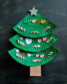 a paper plate christmas tree on a black background