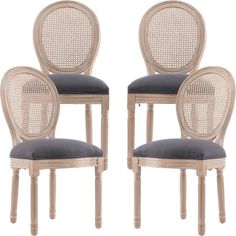 a set of four chairs with grey cushions