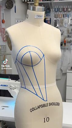 a mannequin with the words collapsible shoulder on it's torso