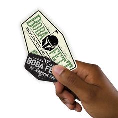 a hand holding up a sticker that says bobaffe on the front and back