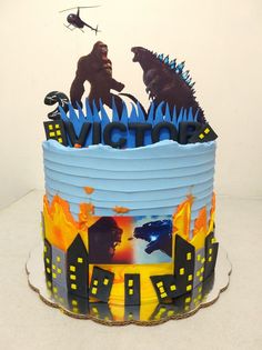 a birthday cake with godzillas on it