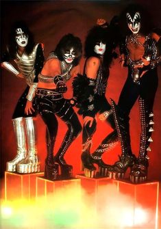 the kiss band posing for a photo in their costumes