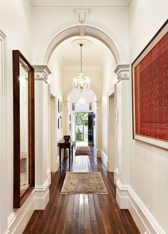 the hallway is clean and ready for us to use as an entrance way in this home