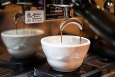 coffee being poured into a white bowl