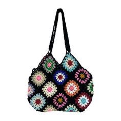 a multicolored crocheted bag hanging from a black string on a white background