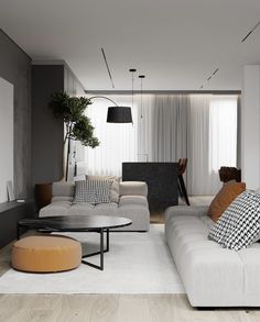 a living room filled with white couches and pillows