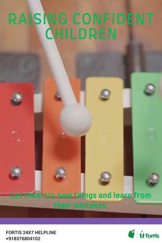 an advertisement for raising confident children with colorful wooden pegs and white ball on top