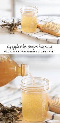 a jar filled with honey sitting on top of a table next to a wooden brush