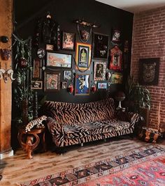 a living room filled with furniture and pictures on the wall