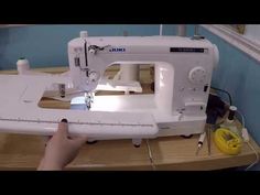 someone is using a sewing machine to sew something