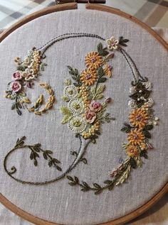 an embroidery project with flowers on it