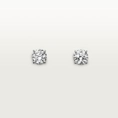 pair of diamond stud earrings in white gold