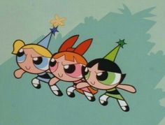 the powerpuff girls are flying through the air with party hats on their heads