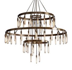 a large chandelier with many lights hanging from it's center and bottom