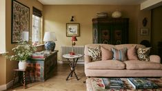 a living room filled with furniture next to a wall mounted radiator and window