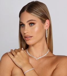 This matching necklace and earrings set is the easiest and most elegant way to finish your look. Featuring a rhinestone necklace, duster earrings, and bracelet, you'll look on point. The necklace and bracelet each come with a lobster clasp closure for easy wear. With this set, you'll be ready for your next fancy dinner with bae! Pair with a long flowy dress and sleek stiletto heels and shine on babe.Fit & FeaturesRhinestone duster earrings, post-back closuresRhinestone bracelet, adjustable chain, lobster clasp closureV-shaped rhinestone necklace, adjustable chain, lobster clasp closureAll showcasing a matching design of small slanted rhinestone bars Earrings are final sale and may not be returned or exchanged. Silver Prom Jewelry, Duster Earrings, Bride Jewelry Set, Prom Necklaces, Formal Jewelry, Prom Accessories, Prom Jewelry, Cubic Zirconia Jewelry, Fancy Dinner