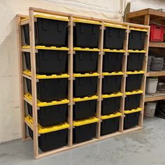 the shelves are filled with black and yellow bins