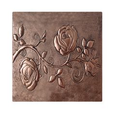 a metal plaque with roses on it