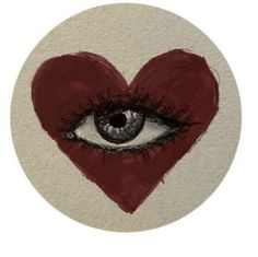 an eye with a red heart on it's side is shown in the shape of a button