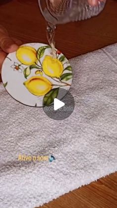 someone is pouring water into a plate with lemons on it