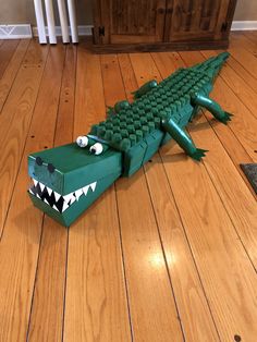 an alligator made out of legos on the floor