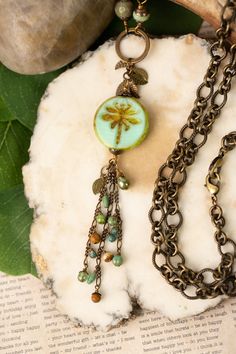 A fun tassel necklace that is longer in design for the Rustic Creek Collection. Handcrafted with Czech glass, turquoise, jasper and featuring a Czech glass dragonfly focal. This artisan design is longer in style resting at 33.25". Antique brass (lead and nickel free) Czech Glass, Turquoise, Jasper 33.25" We hand select our natural materials, thus there may be slight variations in color and/or size that will not detract from the overall aesthetic Our unique handcrafted designer jewelry for women Czech Beads Jewelry Necklaces, Repurposed Accessories, Czech Beads Jewelry, Unique Beaded Jewelry, Beaded Projects, Glass Dragonfly, Czech Glass Necklace, Czech Glass Jewelry, Bead Creations