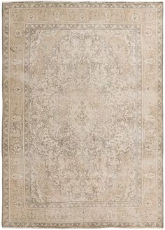 an antique rug with floral design in beige and cream colors, on a white background