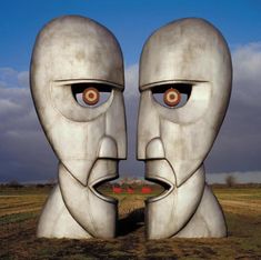 two faces are shown in the middle of a field